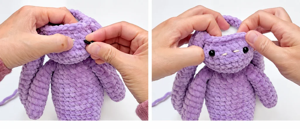 Positioning black safety eyes on the purple crochet bunny face